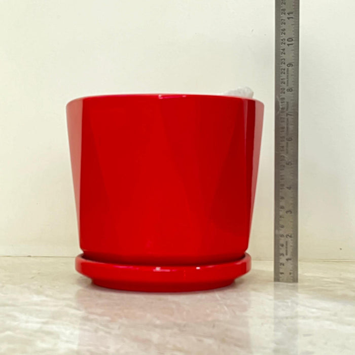 Set of red ceramic indoor pots with geometric pattern