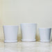 Modern white ceramic pot set with saucers