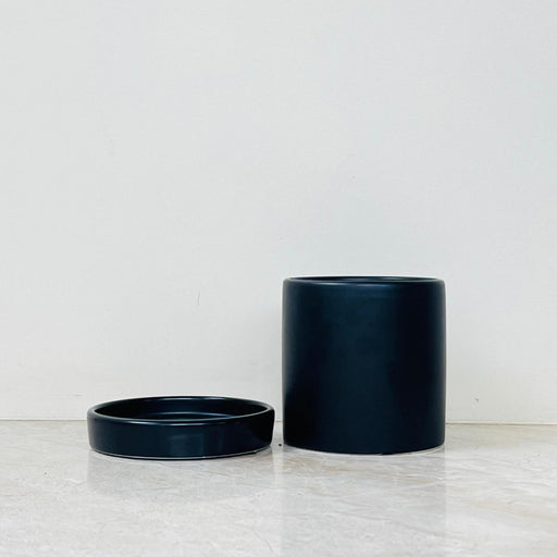 Small black indoor plant pot with matching saucer