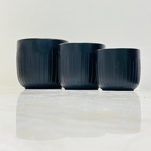 Small matte black ribbed ceramic planter