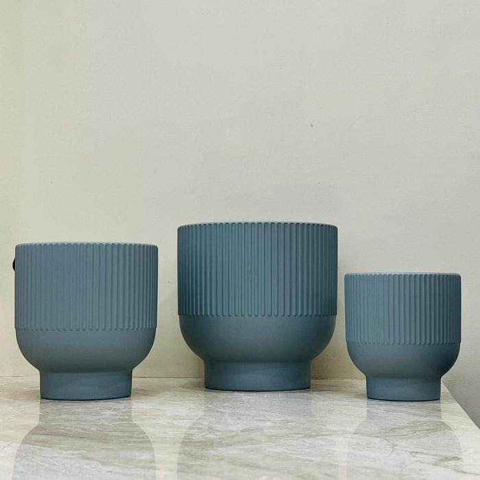 Small matte blue ribbed ceramic planter