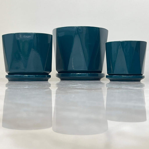 Teal geometric ceramic planter set with matching trays