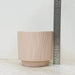 Textured ceramic plant pot in blush pink