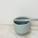 Round grey ceramic planter for indoor plants