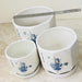 Elegant white ceramic pots with traditional blue floral motifs