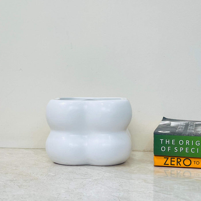 White bulbous ceramic planter with organic shape