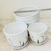 Artistic white ceramic planters with flower motif