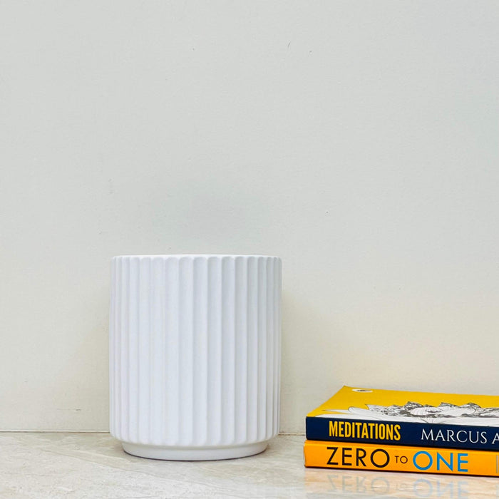 White ribbed ceramic planter for indoor plants